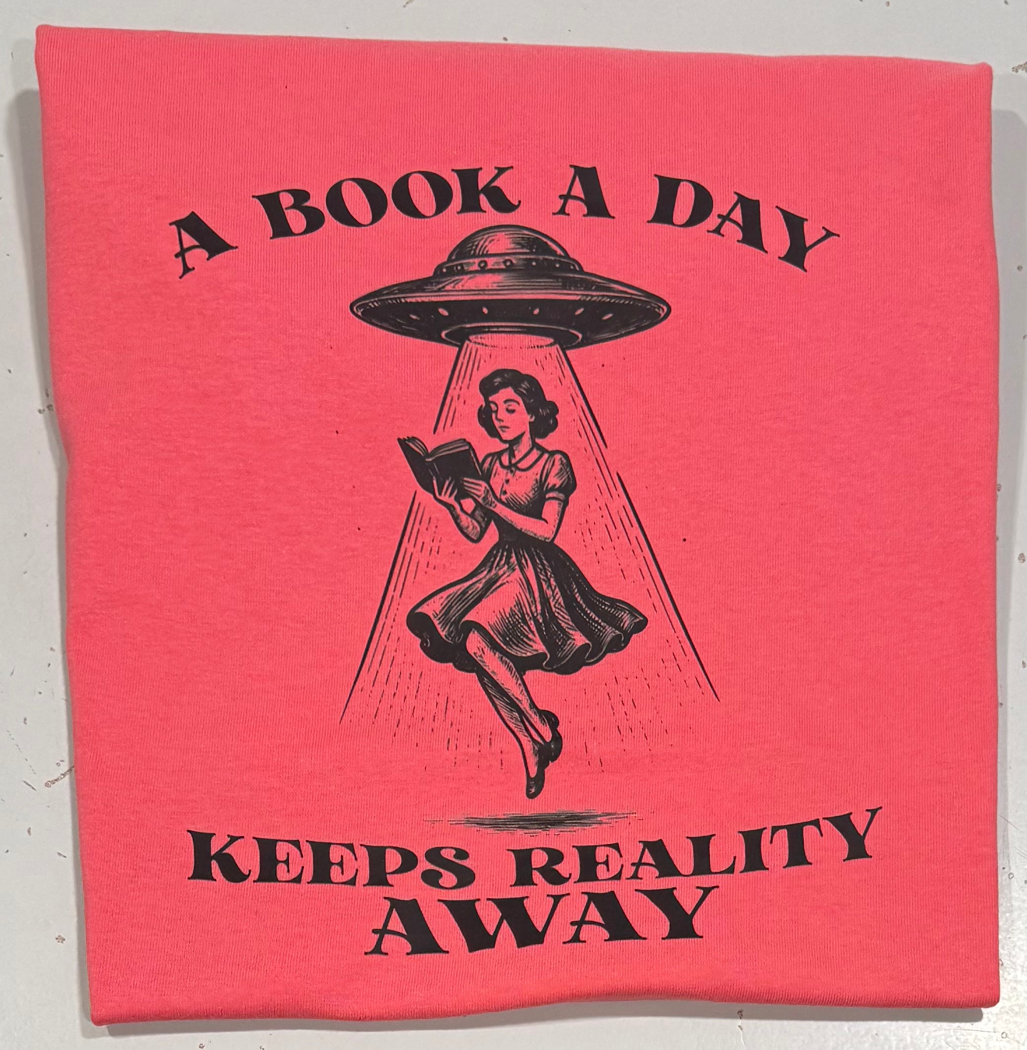 A book a day keeps reality away tshirt